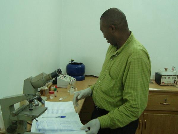 Laboratory technician at the microscope