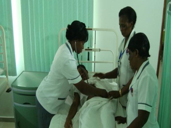 Nurses attending to a patient