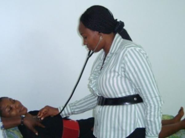Doctor and nurse with a patient